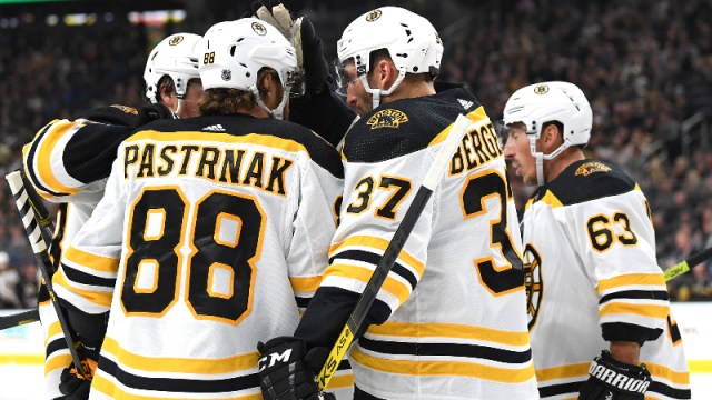 ; Boston Bruins right wing David Pastrnak (88) and teammates