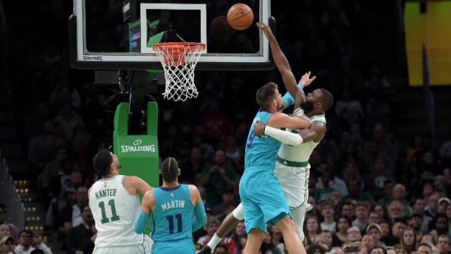 Boston Celtics guard Jaylen Brown (7) and Charlotte Hornets center Willy Hernangomez Geuer (9)