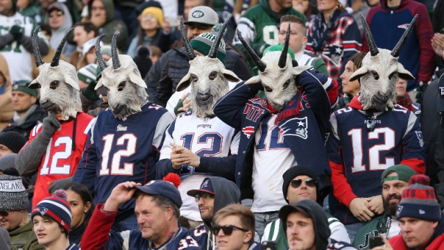 Fans wearing New England Patriots quarterback Tom Brady