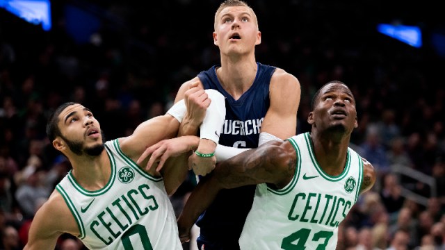 Dallas Mavericks forward Kristaps Porzingis (6) and Boston Celtics forward Jayson Tatum (0) and guard Javonte Green (43)
