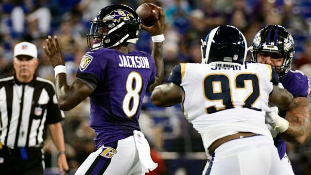 Baltimore Ravens quarterback Lamar Jackson and Los Angeles Rams defensive tackle Tanzel Smart