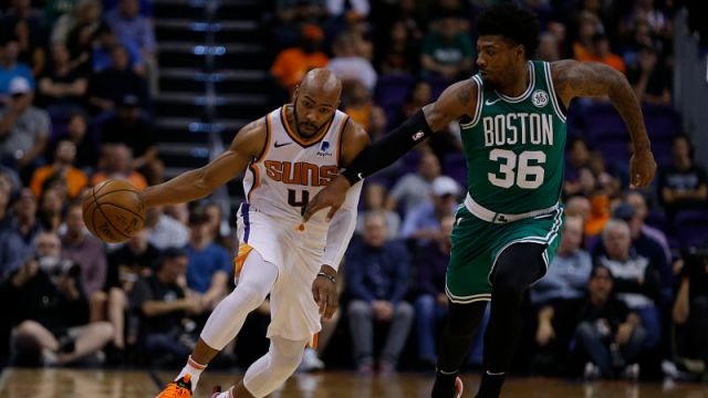Phoenix Suns guard Jevon Carter and Boston Celtics guard Marcus Smart