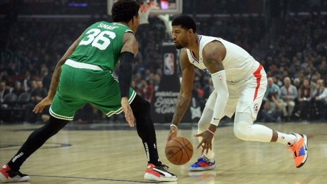 Los Angeles Clippers forward Paul George (13) and Boston Celtics guard Marcus Smart (36)