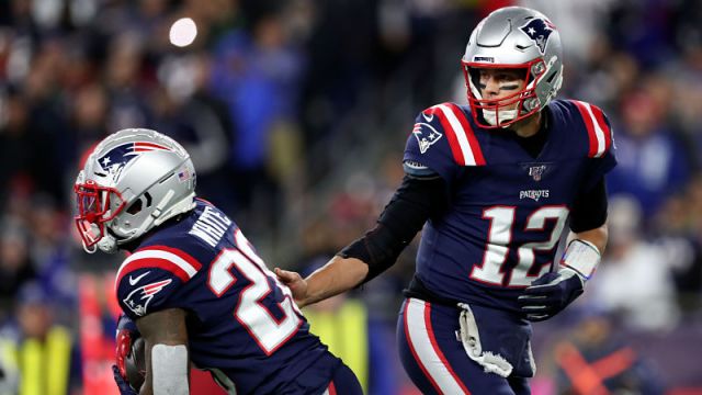 New England Patriots running back James White and quarterback Tom Brady