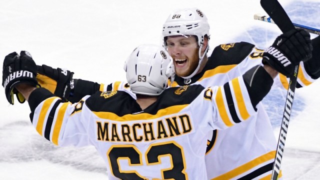 Boston Bruins left wing Brad Marchand (63) and right wing David Pastrnak (88)