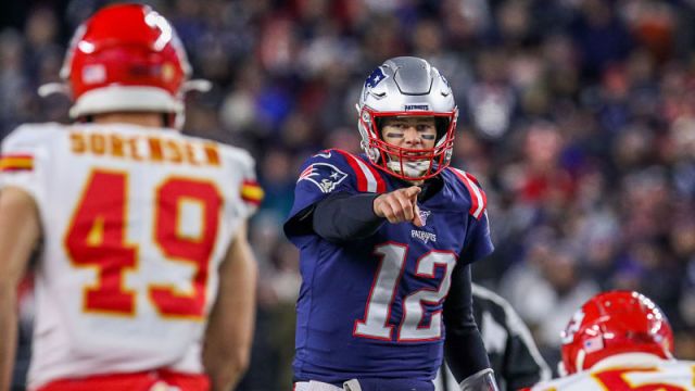 Kansas City Chiefs safety Daniel Sorenson and New England Patriots quarterback Tom Brady
