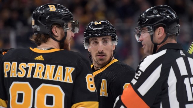 Boston Bruins right wing David Pastrnak (88) and left wing Brad Marchand (63)