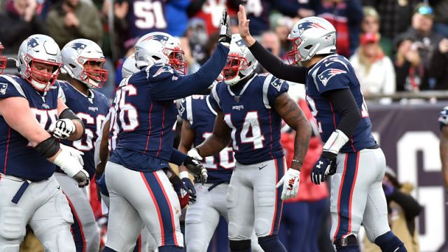 New England Patriots left tackle Isaiah Wynn and quarterback Tom Brady