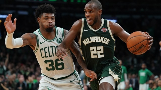 Milwaukee Bucks forward Khris Middleton (22) and Boston Celtics guard Marcus Smart (36)
