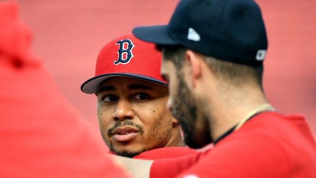 Boston Red Sox right fielder Mookie Betts (left) and designated hitter J.D. Martinez (right)