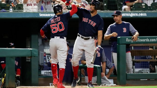 Boston Red Sox right fielder Mookie Betts (50) and shortstop Xander Bogaerts (2)