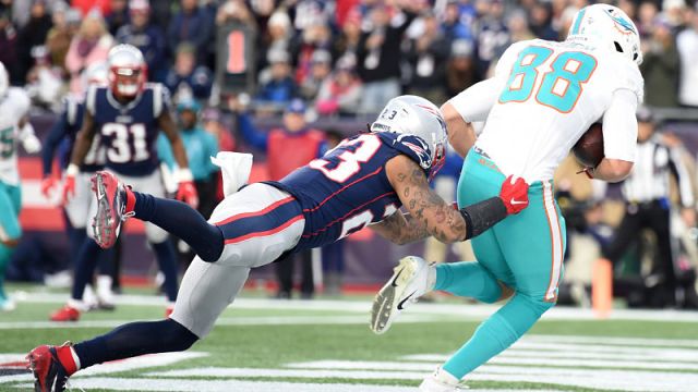 New England Patriots safety Patrick Chung and Miami Dolphins tight end Mike Gesicki