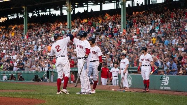Boston Red Sox designated hitter J.D. Martinez (28) and shortstop Xander Bogaerts (2)