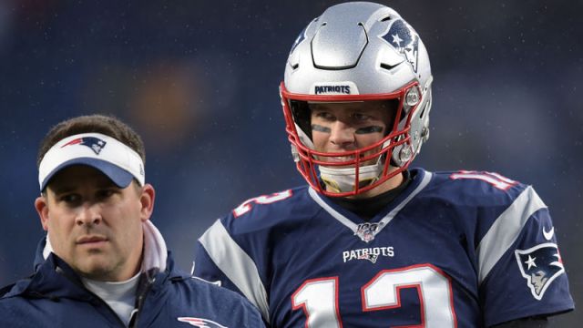 New England Patriots offensive coordinator Josh McDaniels and quarterback Tom Brady
