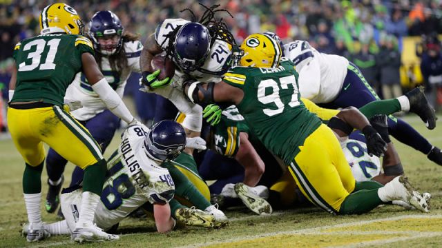 Seattle Seahawks running back Marshawn Lynch and Green Bay Packers defensive lineman Kenny Clark