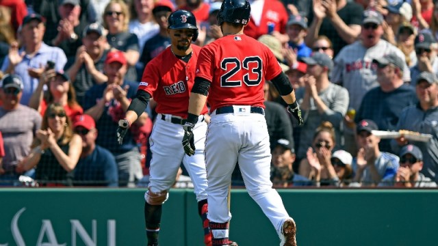 Boston Red Sox third baseman Michael Chavis (23) and right fielder Mookie Betts (50)