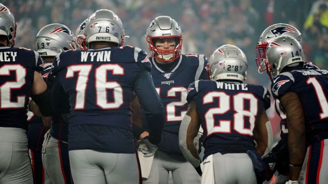 New England Patriots left tackle Isaiah Wynn, quarterback Tom Brady and running back James White