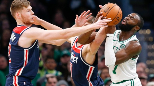 Boston Celtics guard Jaylen Brown (7) and Washington Wizards center Davis Bertans (42) and forward Moritz Wagner (21)