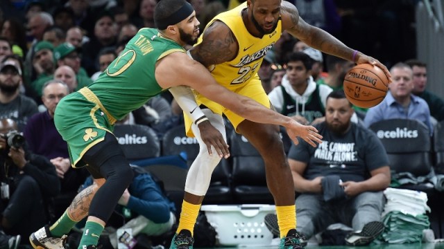 Boston Celtics forward Jayson Tatum (0) and Los Angeles Lakers forward LeBron James (23)