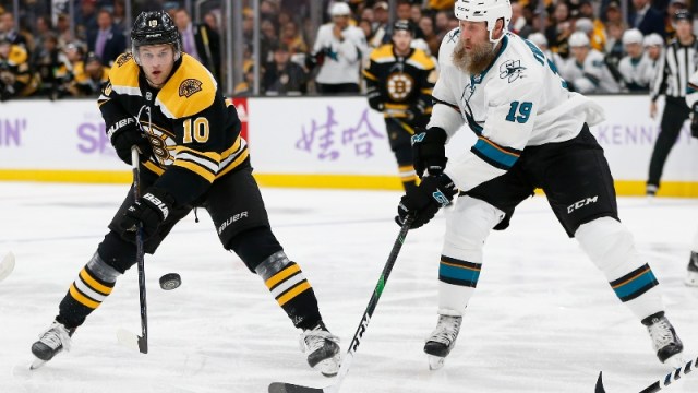 Boston Bruins left wing Anders Bjork (10) and San Jose Sharks center Joe Thornton (19)