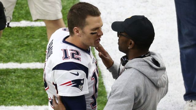 New England Patriots quarterback Tom Brady and former NFL wide receiver Randy Moss