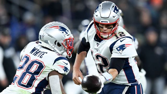 New England Patriots running back James White and NFL quarterback Tom Brady