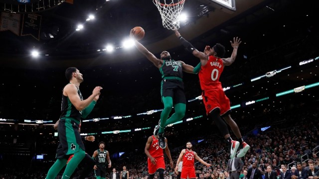 Boston Celtics guard Jaylen Brown (7) and Toronto Raptors guard Terence Davis (0)