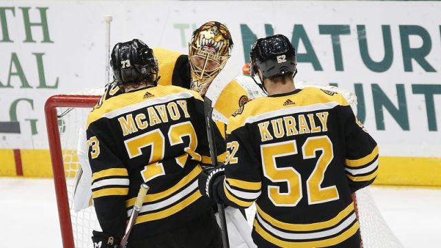 Boston Bruins' Tuukka Rask, Sean Kuraly, Charlie McAvoy