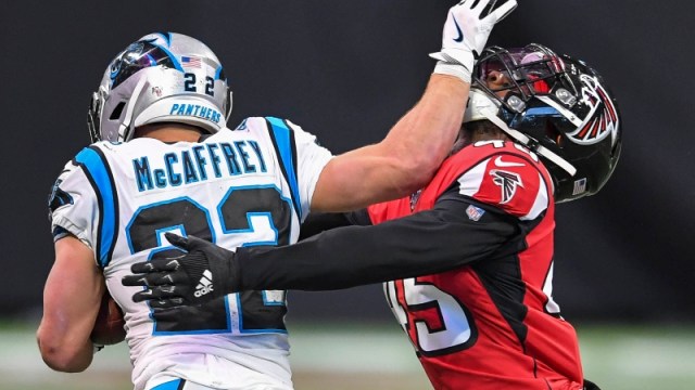 Carolina Panthers running back Christian McCaffrey (22) and Atlanta Falcons linebacker Deion Jones (45)