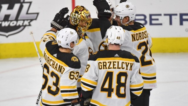 Boston Bruins' Tuukka Rask (40), Brad Marchand (63), Matt Grzelcyk (48) and Joakim Nordstrom (20)