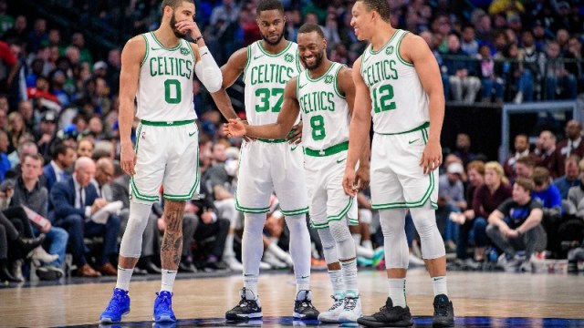 Boston Celtics forwards Jayson Tatum (0), Semi Ojeleye (37), Grant Williams (12) and guard Kemba Walker (8)