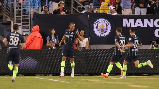Manchester City midfielder Leroy Sane (center)