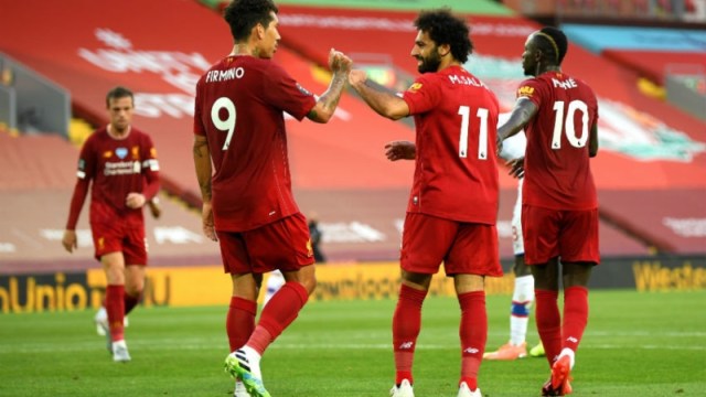 Liverpool forwards Roberto Firmino (left), Mohamed Salah (center) and Sadio Mane