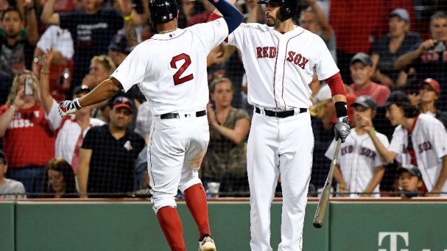 Boston Red Sox shortstop Xander Bogaerts (2) and designated hitter J.D. Martinez (28)