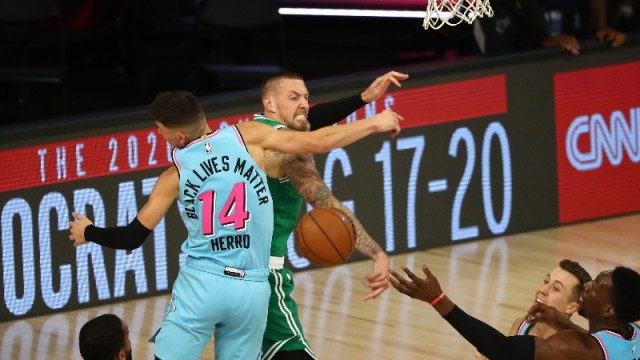 Boston Celtics center Daniel Theis (27) and Miami Heat guard Tyler Herro (14)