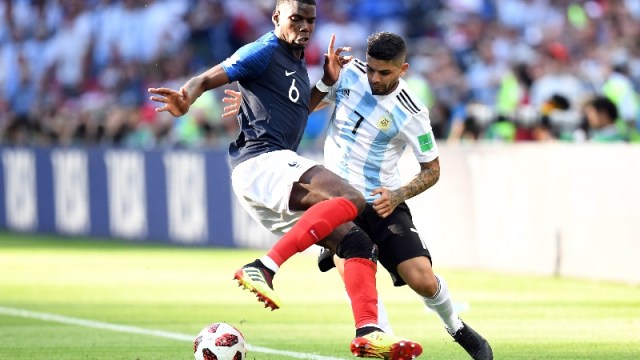 France midfielder Paul Pogba (6) and Argentina midfielder Ever Banega (7)