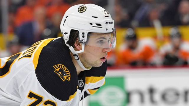 Boston Bruins' Connor Clifton warms up before an NHL hockey game