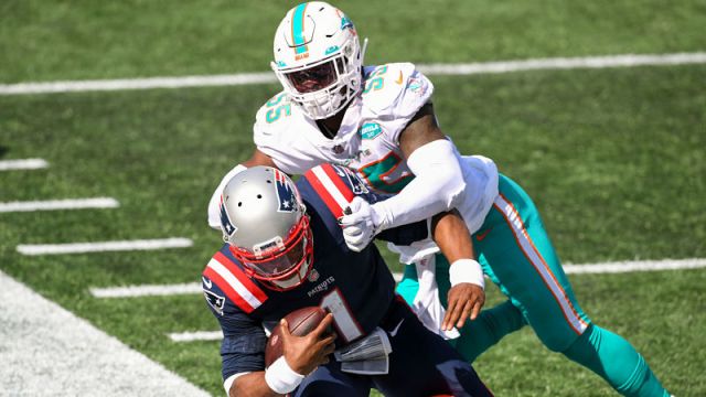 New England Patriots quarterback Cam Newton and Miami Dolphins running back Jerome Baker
