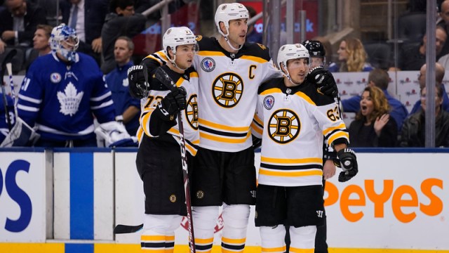 Boston Bruins' Charlie McAvoy, Zdeno Chara And Brad Marchand