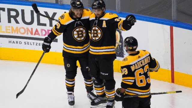 Boston Bruins center Patrice Bergeron (37), right wing David Pastrnak (88) and left wing Brad Marchand (63)