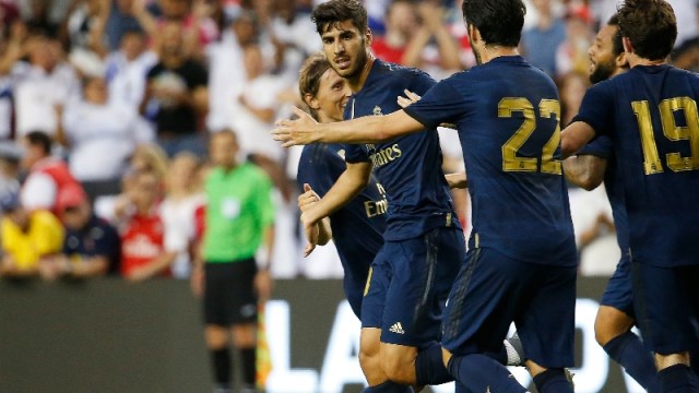 Real Madrid midfielder Marco Asensio (20) and teammates