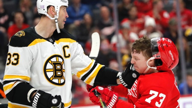 Boston Bruins defenseman Zdeno Chara (33) and Detroit Red Wings left wing Adam Erne (73)