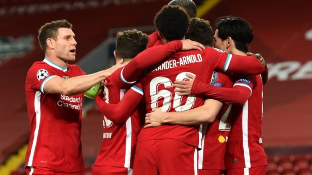 Liverpool midfielder James Milner (left) and teammates