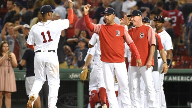 Boston Red Sox third baseman Rafael Devers and MLB manager Alex Cora
