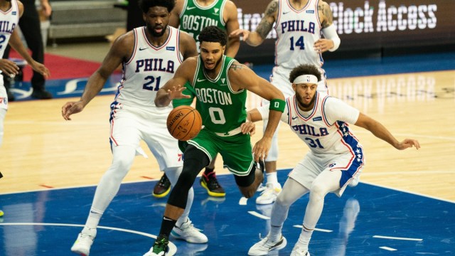 Boston Celtics forward Jayson Tatum (0) and Philadelphia 76ers guard Seth Curry (31) and center Joel Embiid (21)