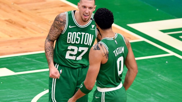 Boston Celtics forward Jayson Tatum (0) and center Daniel Theis (27)
