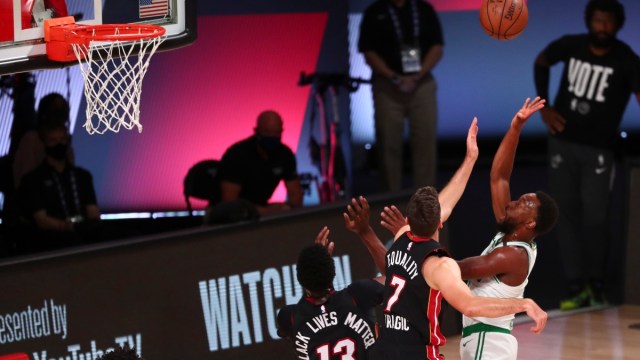 Boston Celtics guard Kemba Walker (8) and Miami Heat guard Goran Dragic (7)