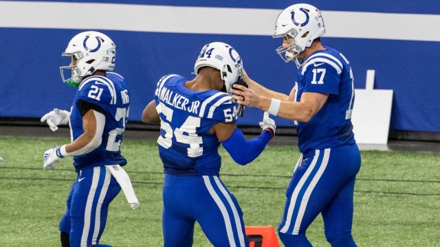 Indianapolis Colts quarterback Philip Rivers (17) and middle linebacker Anthony Walker (54)