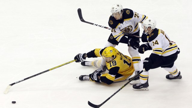 Boston Bruins defenseman Charlie McAvoy, forward Chris Wagner; Pittsburgh Penguins forward Jared McCann