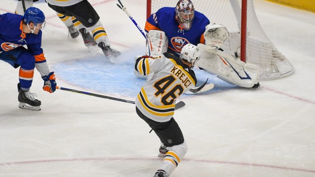 Boston Bruins center David Krejci (46) and New York Islanders goaltender Semyon Varlamov (40)